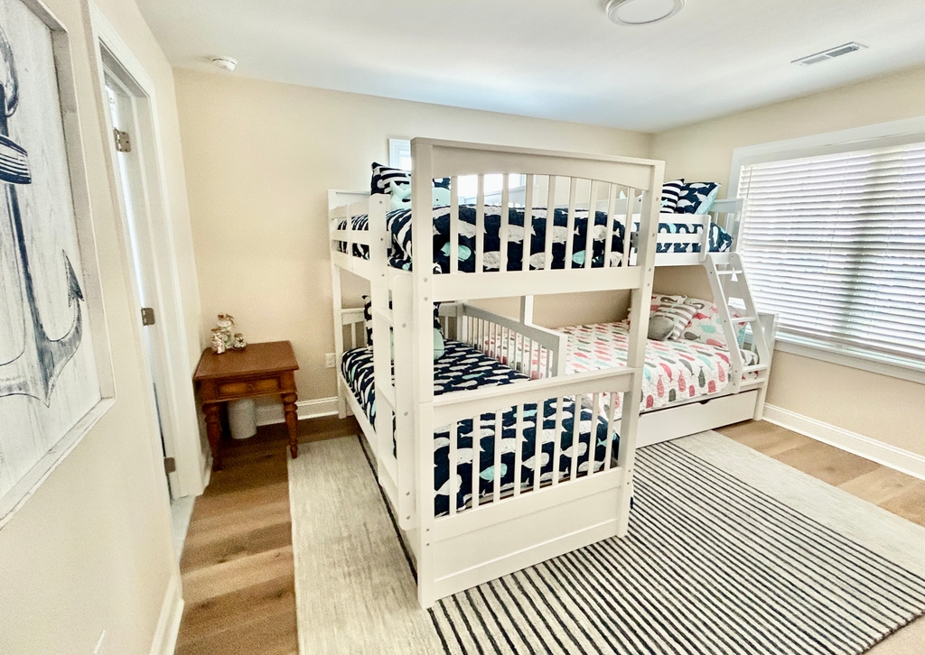 6th BD bunk room with twin over twin, twin over full over full trundle. Extra pillows and bedding provided, shared jack an jill BA