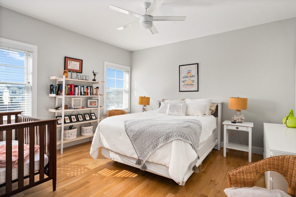 Queen bedroom with a crib