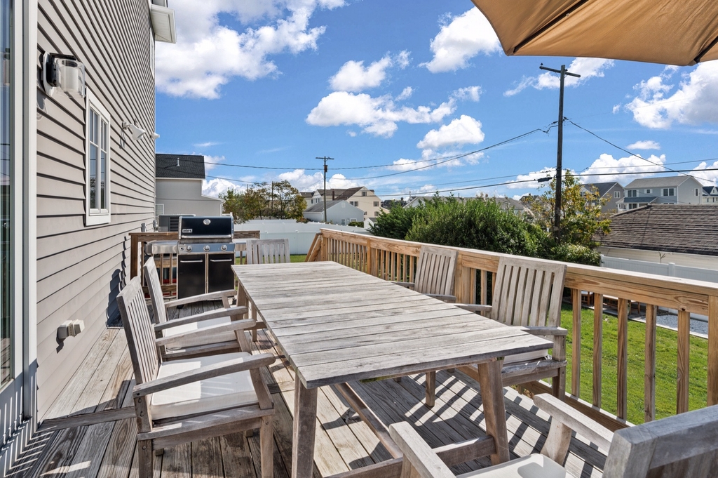 Back porch off dining room with a natural gas grill 