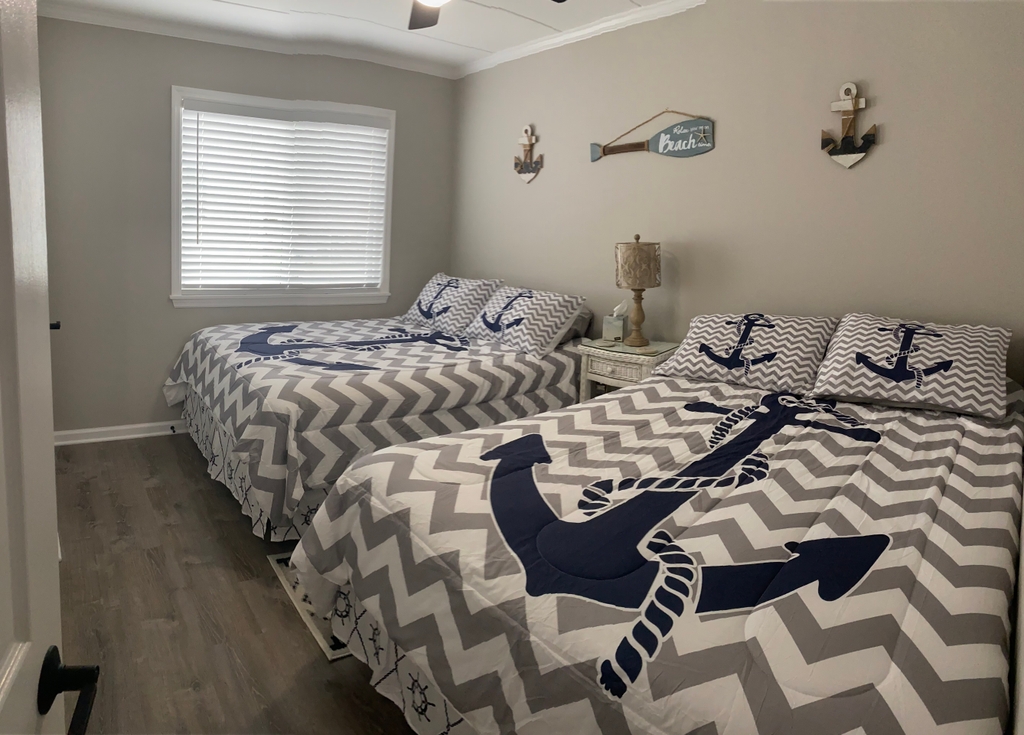 Bedroom with 2 Brand New Queens Beds
