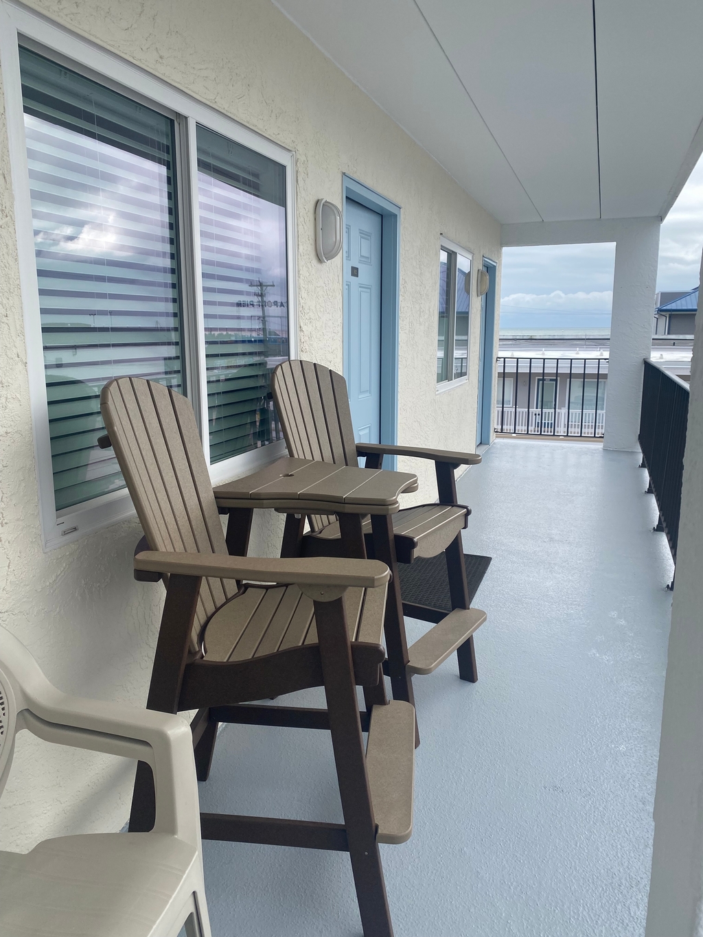 Outside unit Patio Area W/Adirondack Patio Chairs.