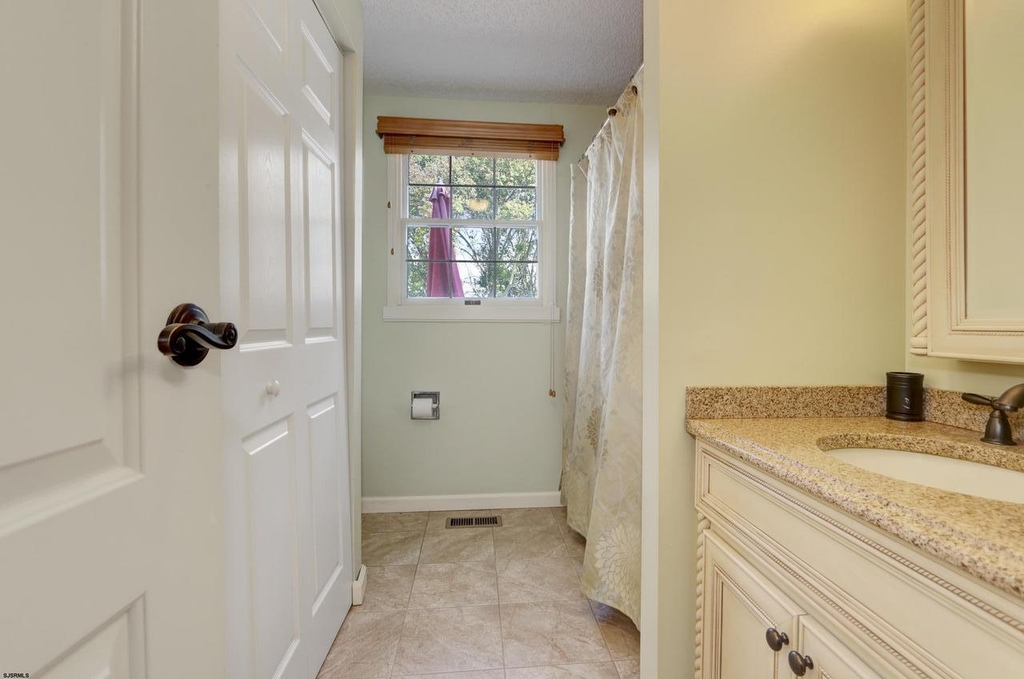 Downstairs Full Bath/Laundry Room