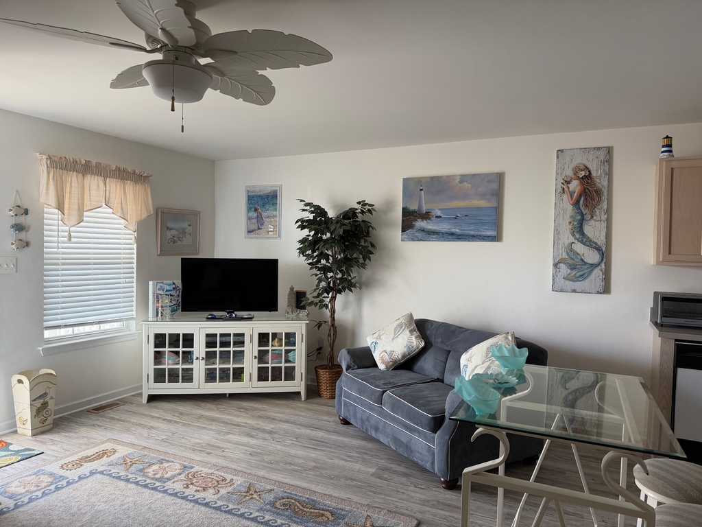 Open LR with queen sleeper sofa and love seat