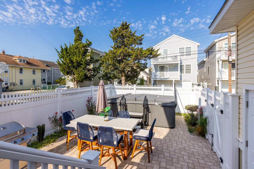 Fenced in back yard with spa hot tub