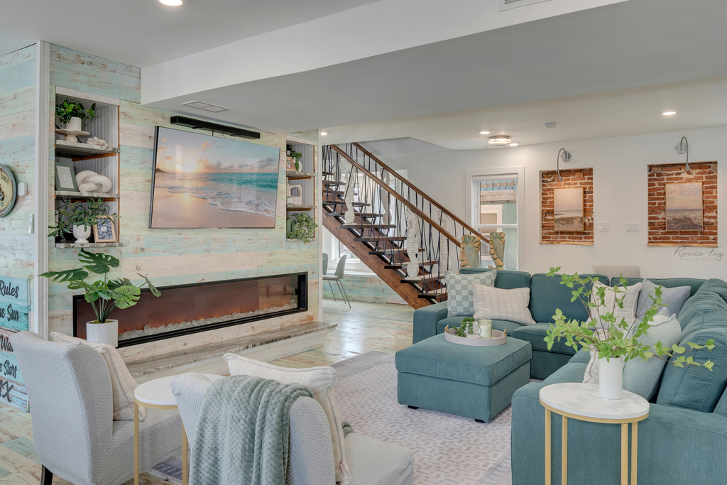 Back in the living room with stairs to second floor