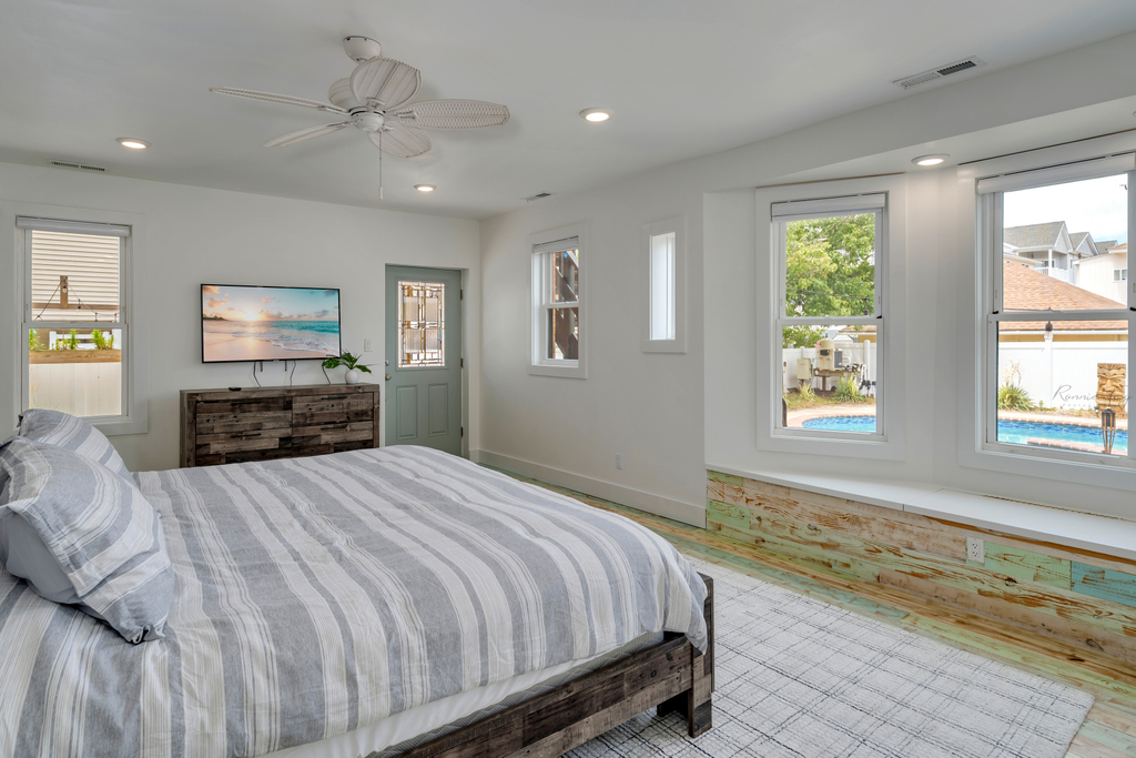 First floor master bedroom with view to pool