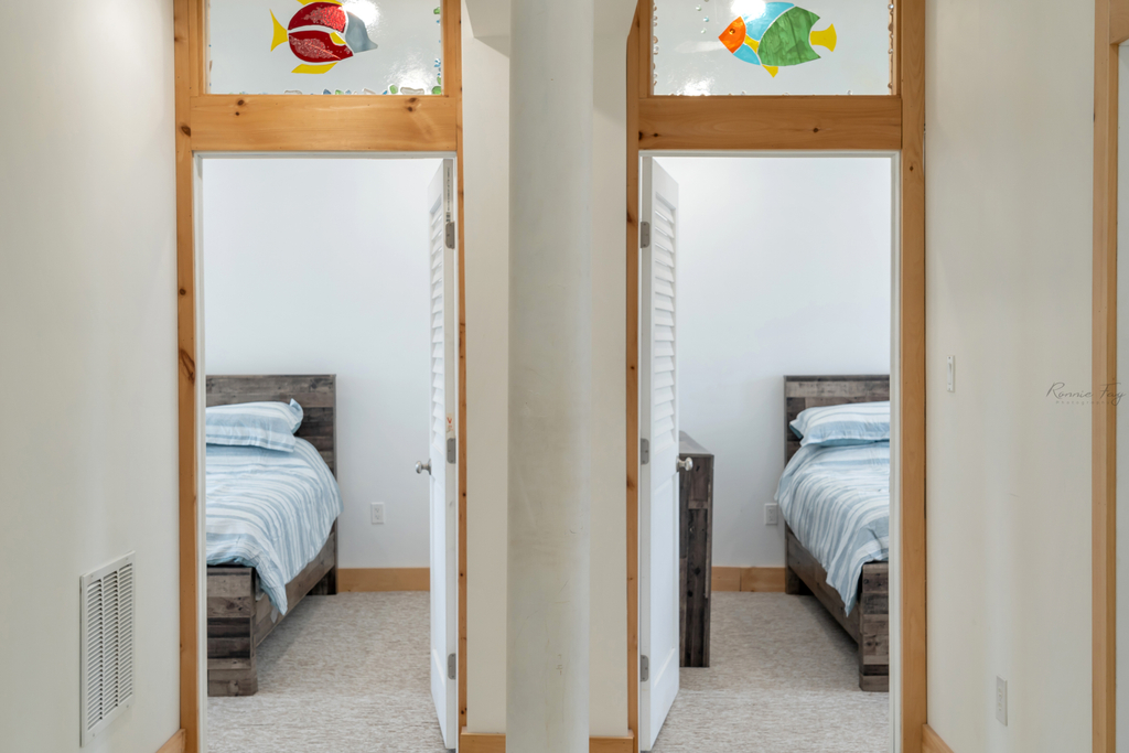 side by side queen bedrooms with ensuite bathrooms on second floor