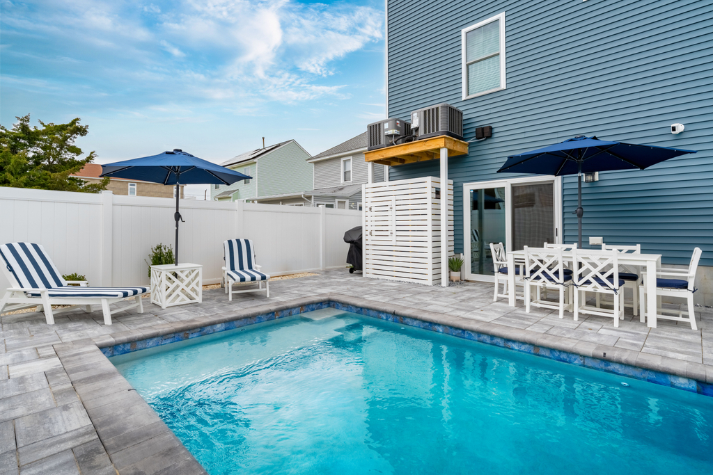 Heated in ground pool with multiple seating areas