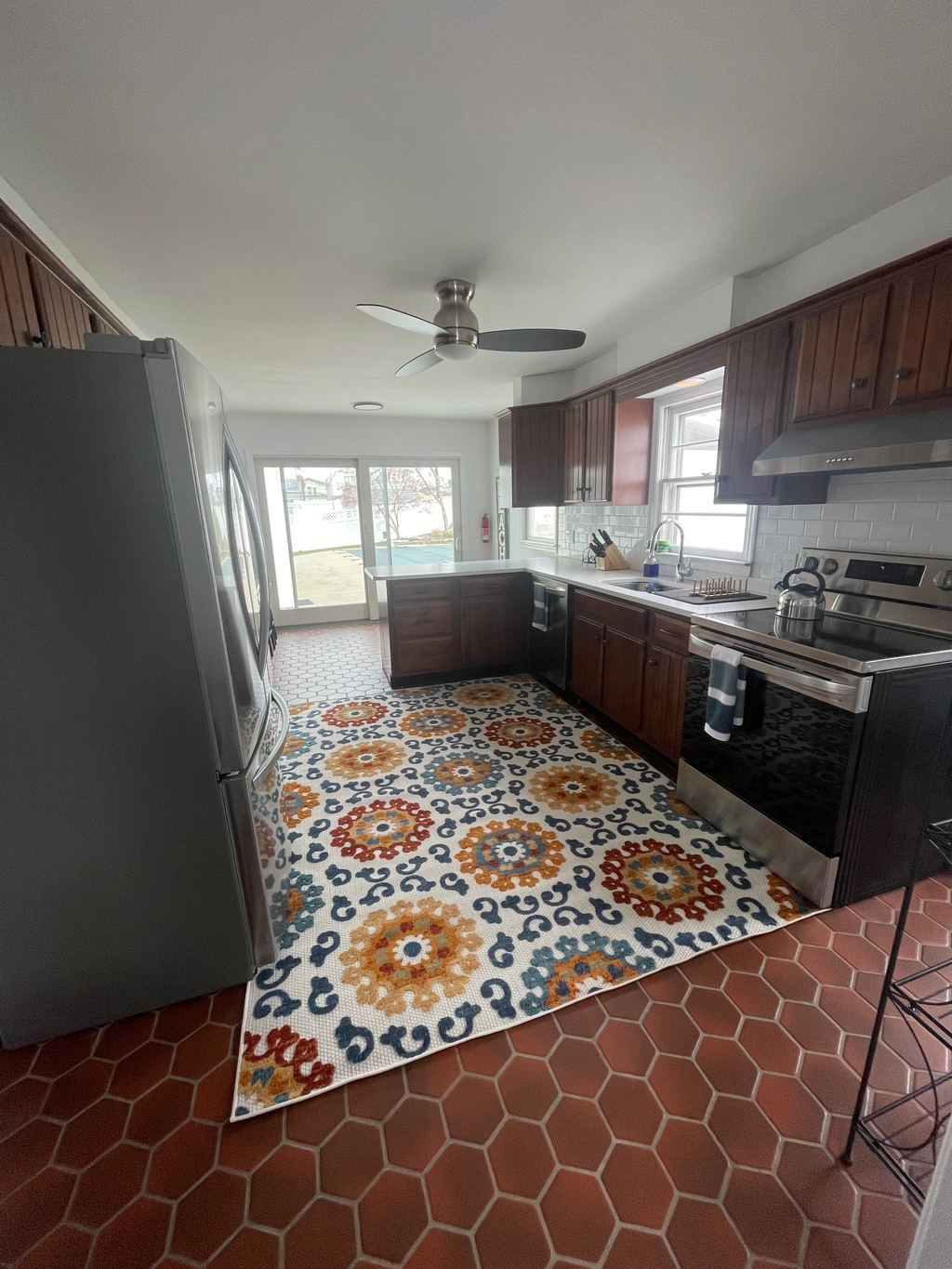 kitchen with new stainless steel appliances, electric stove