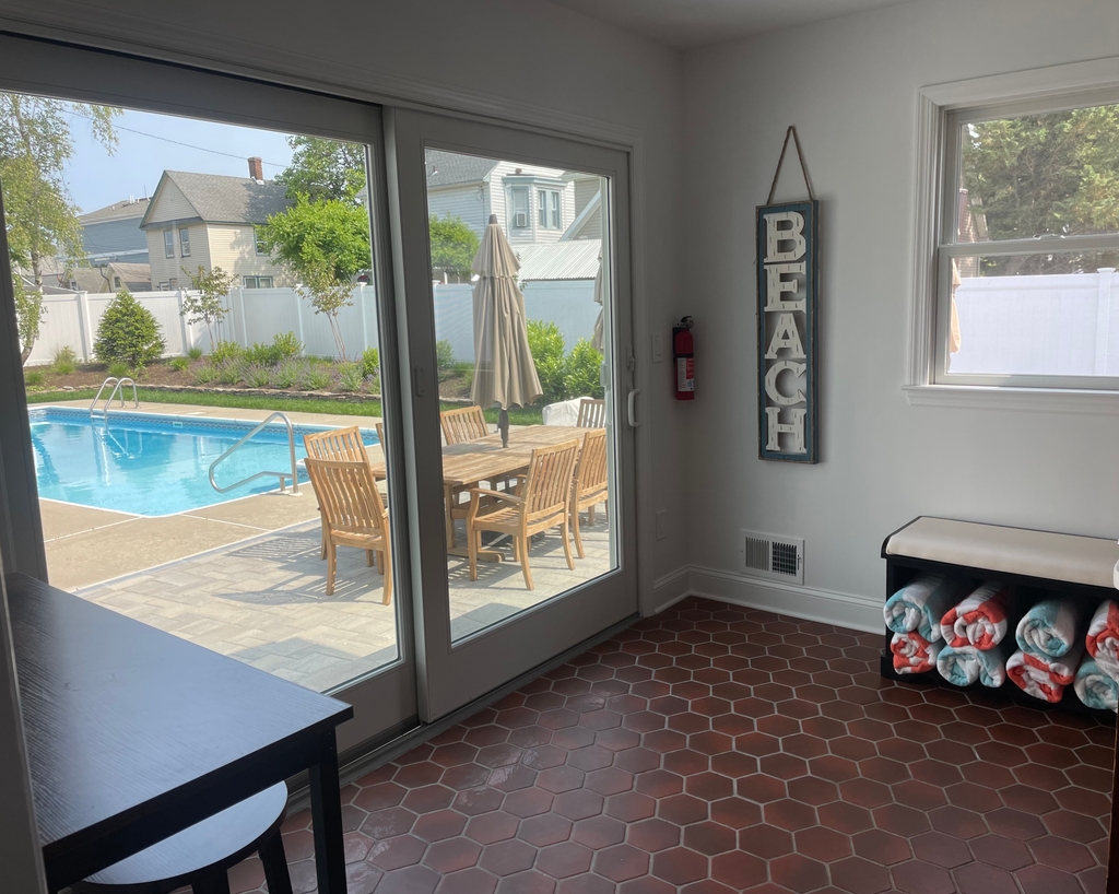 sliding glass door to backyard pool area