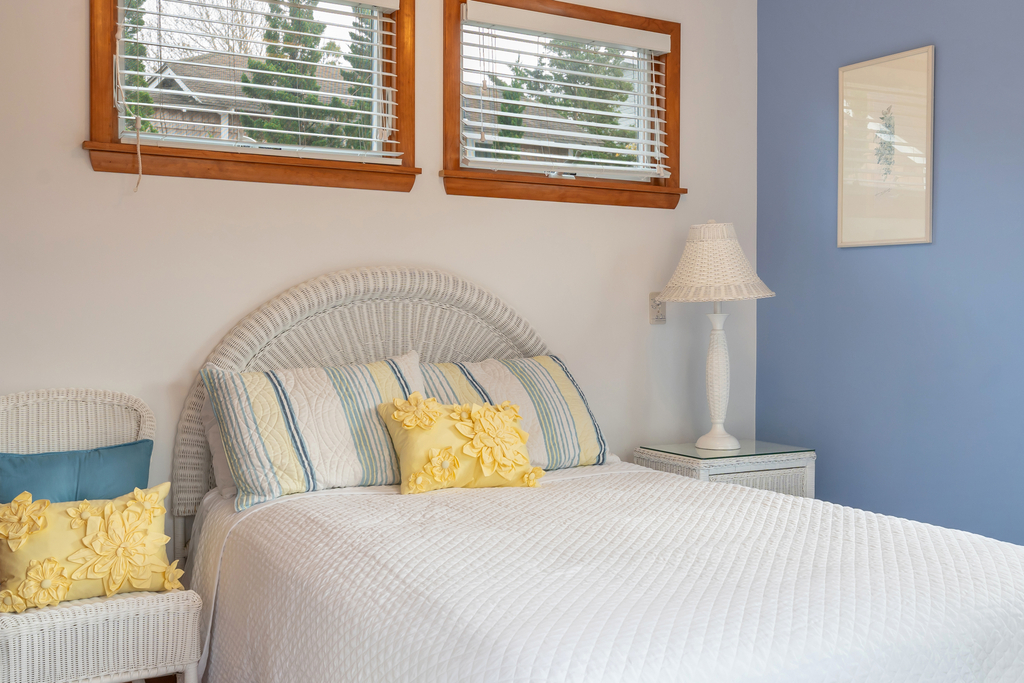 Full bed in this light and airy back bedroom