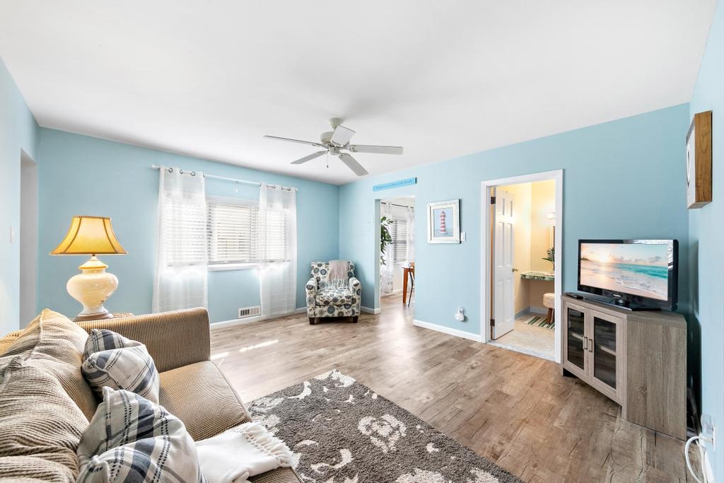 Den seating with ceiling fan.