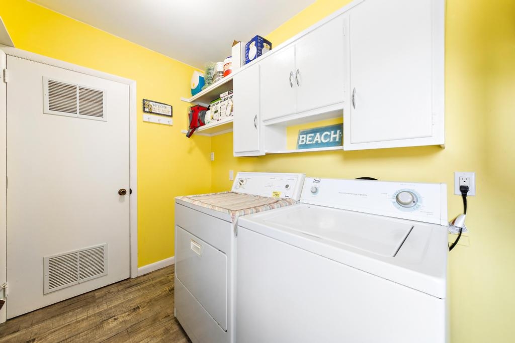 Full size dedicated laundry room with two full size machines. 