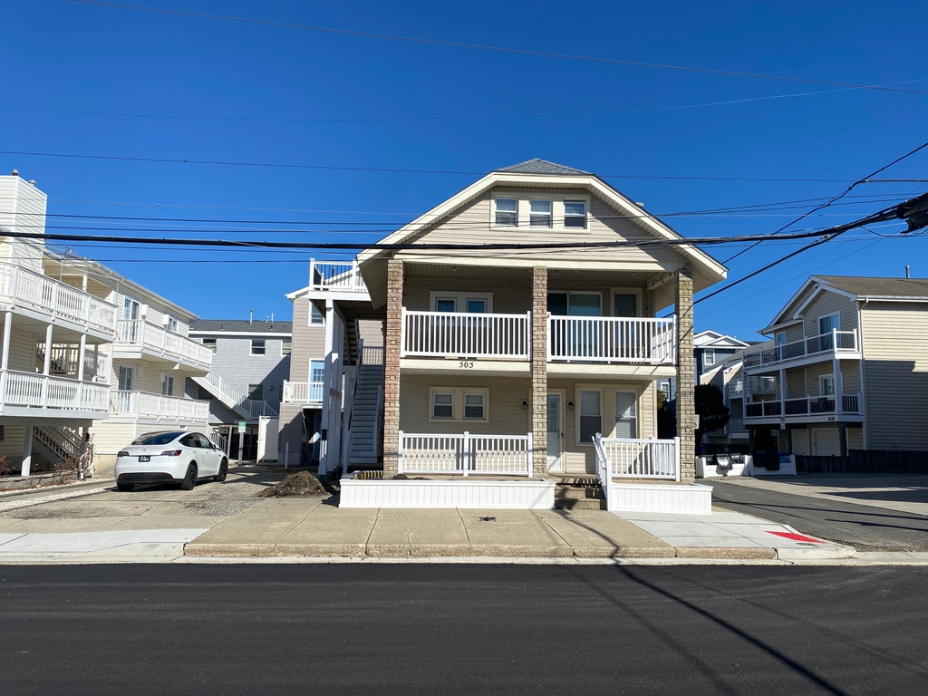 Photo of home, gray deck on left accesses our home.