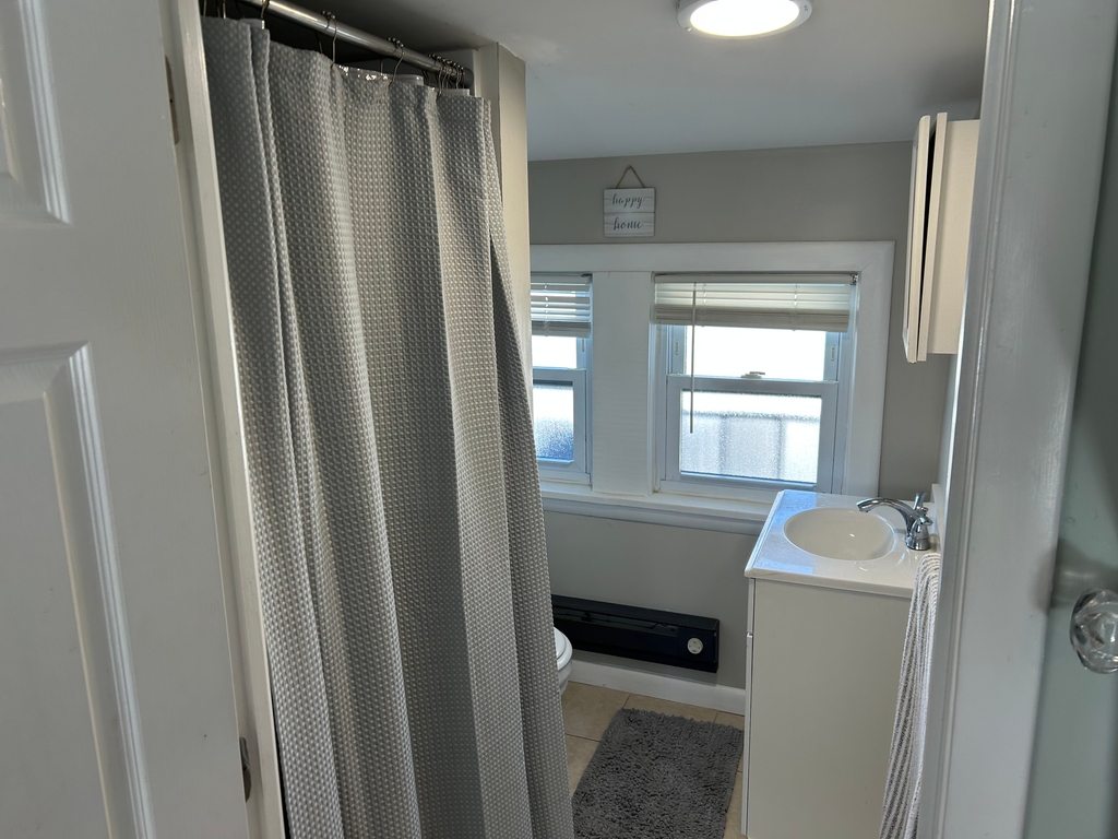 Bathroom with updated shower.