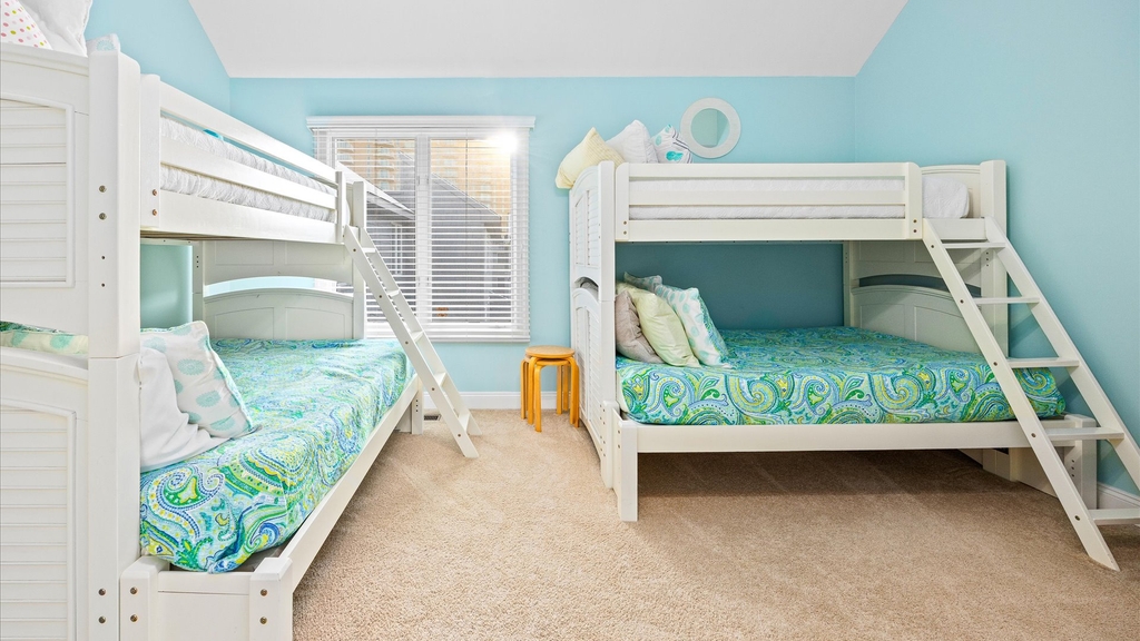 Bunk room with 2 twin over full bunks and private bathroom on top level