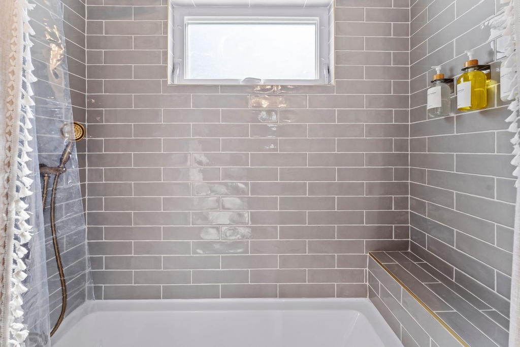 Full bathroom with bathtub