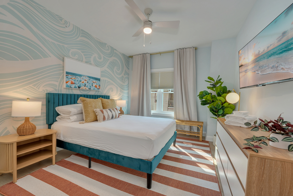 Vibrant Queen Bedroom with Bold Touches, Storage Space &amp;amp; Black Out Shades