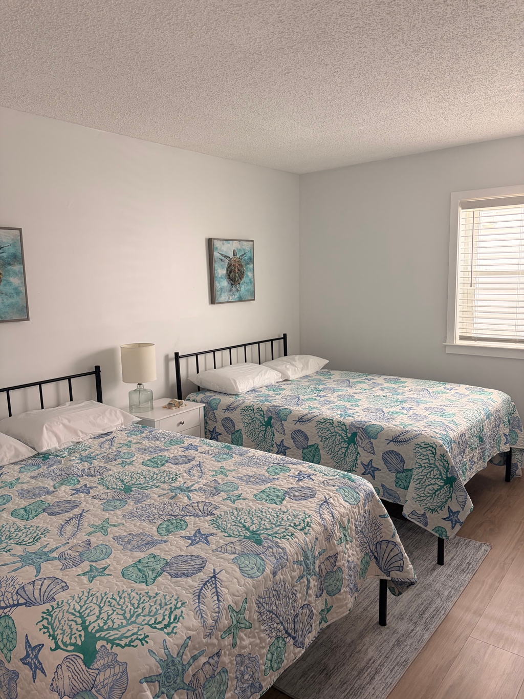 Bedroom two with two full beds.