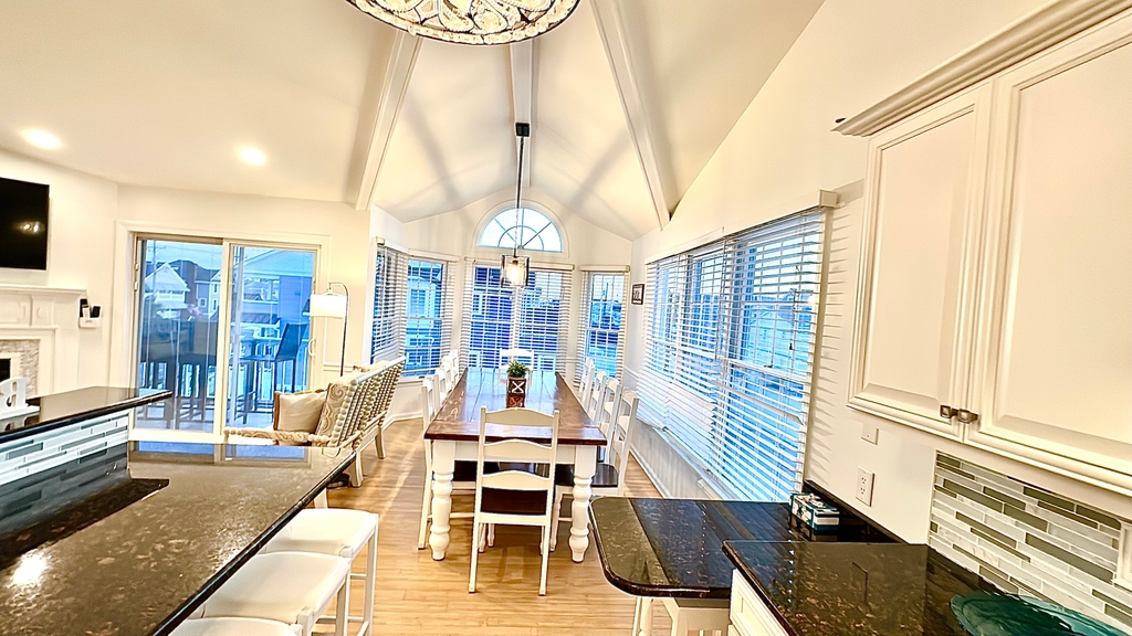 Dining Room with 12 person farm table plus seating for 6 at two counters