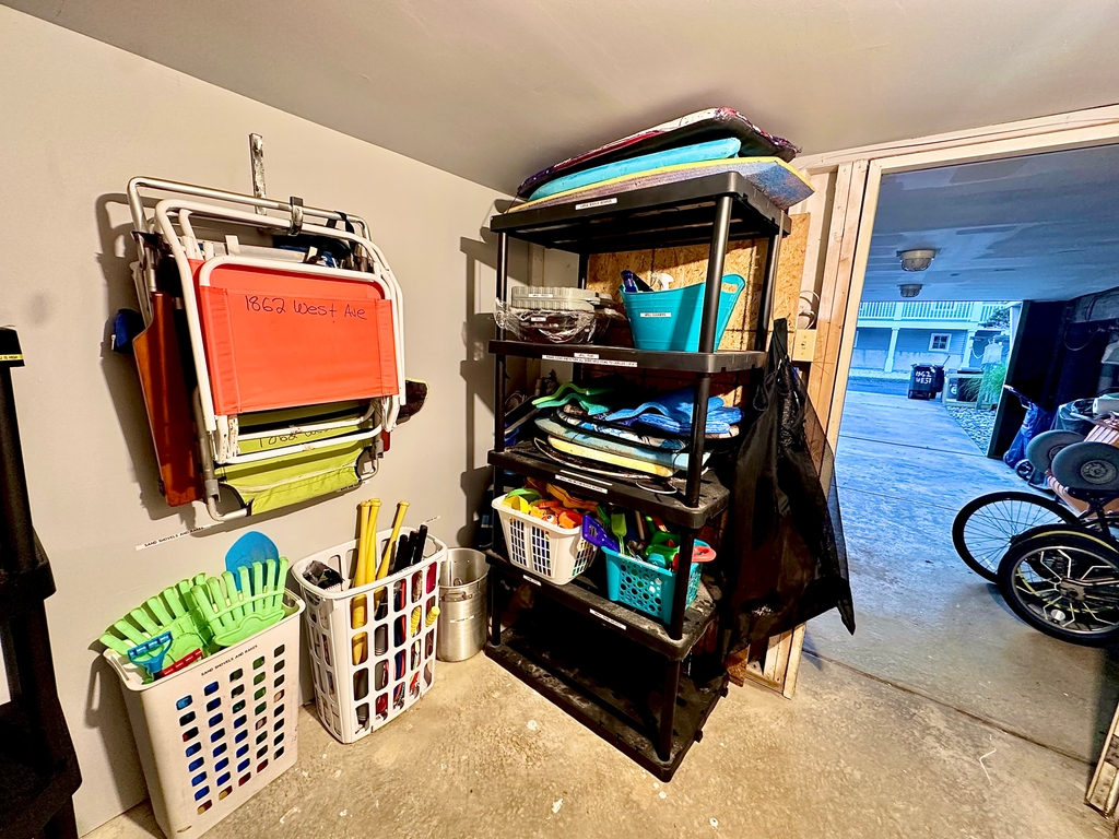 Storage room that locks with beach chairs, beach, toys, and beach equipment.