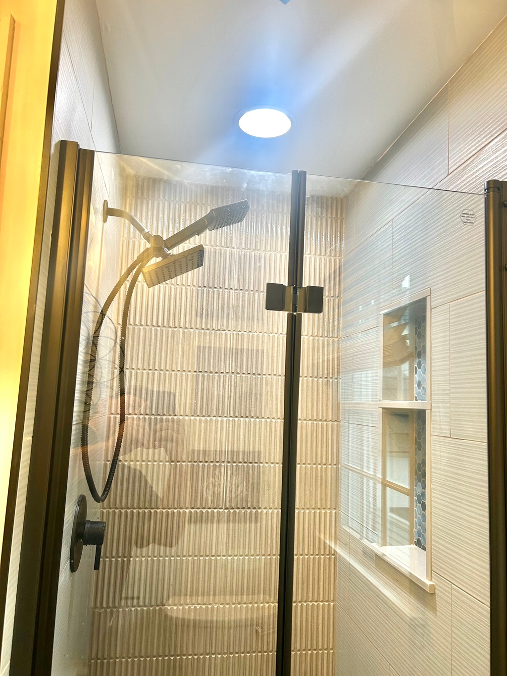 BRAND NEW Shower for 3rd full bath on 2nd floor. Pocket door can be closed to make it an en-suite for 2nd floor full bunk room or left open to give access to hall.