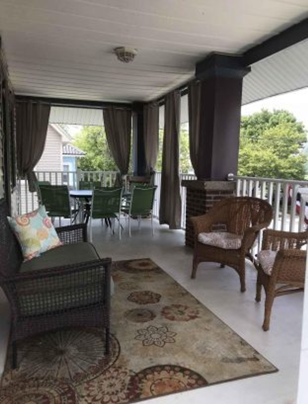 2nd floor porch with sun blocking curtains