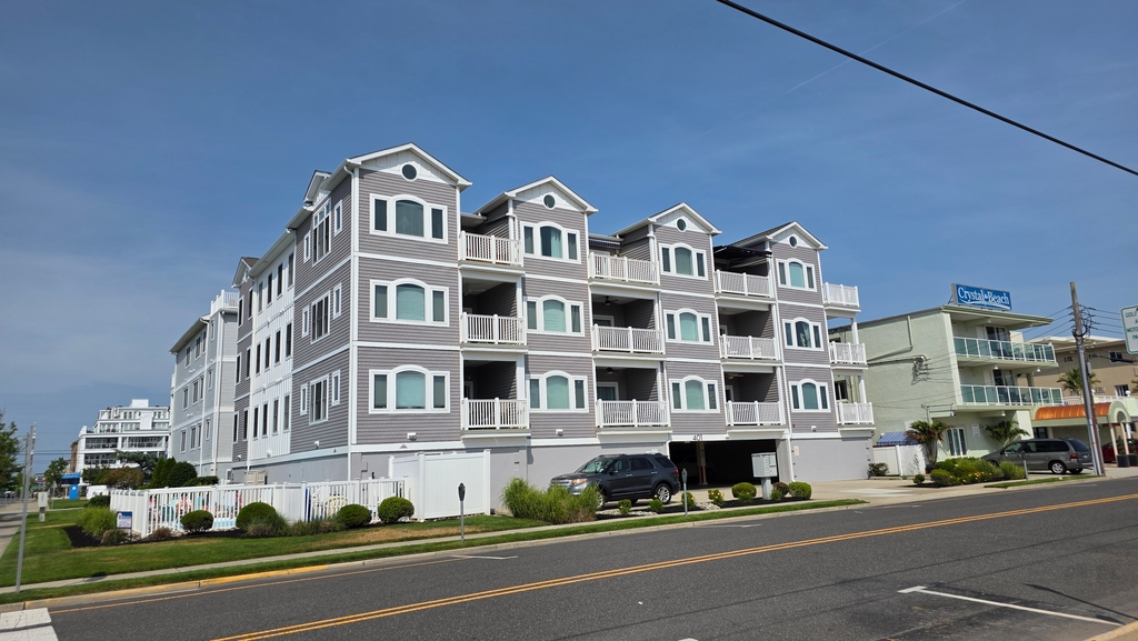 Top Left Unit of Building From Park Across Street