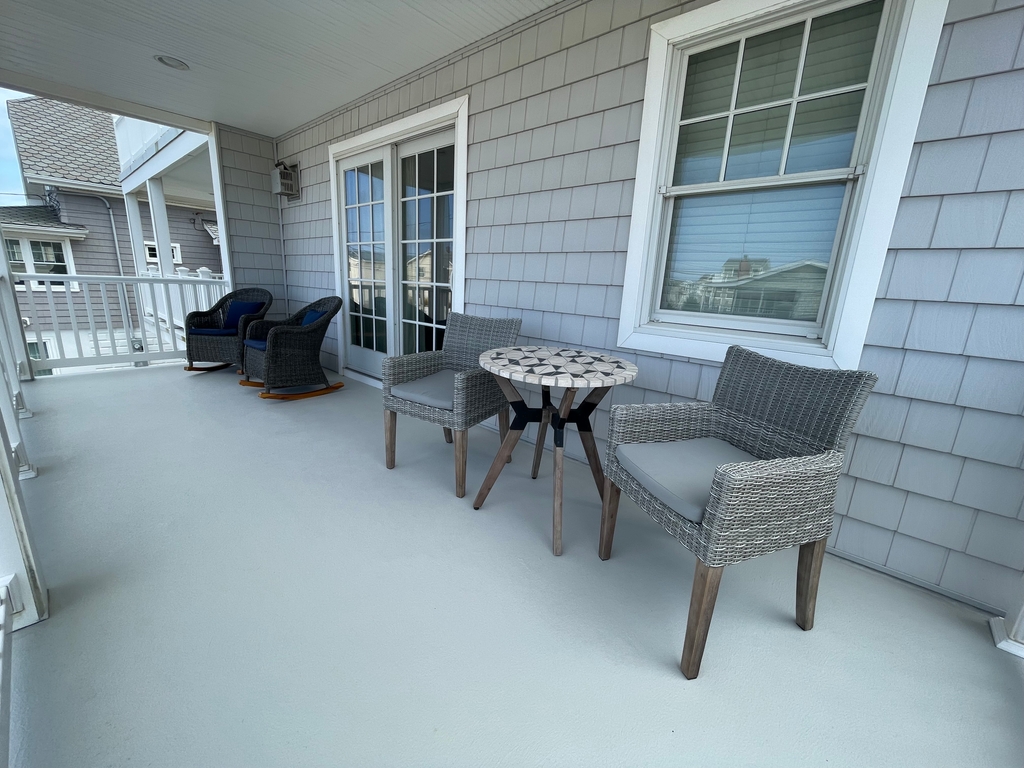 Front Deck off LR w/ Rockers and Cafe Set