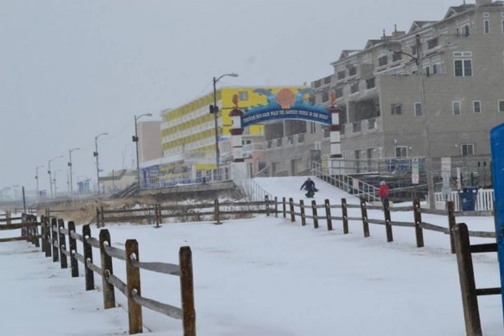LET IT SNOW at the beach! Sledding the Boardwalk by the North Wildwood Arch!  Always FUN at our North Wildwood Heavenly Havens Oceanfront Vacation Rentals!