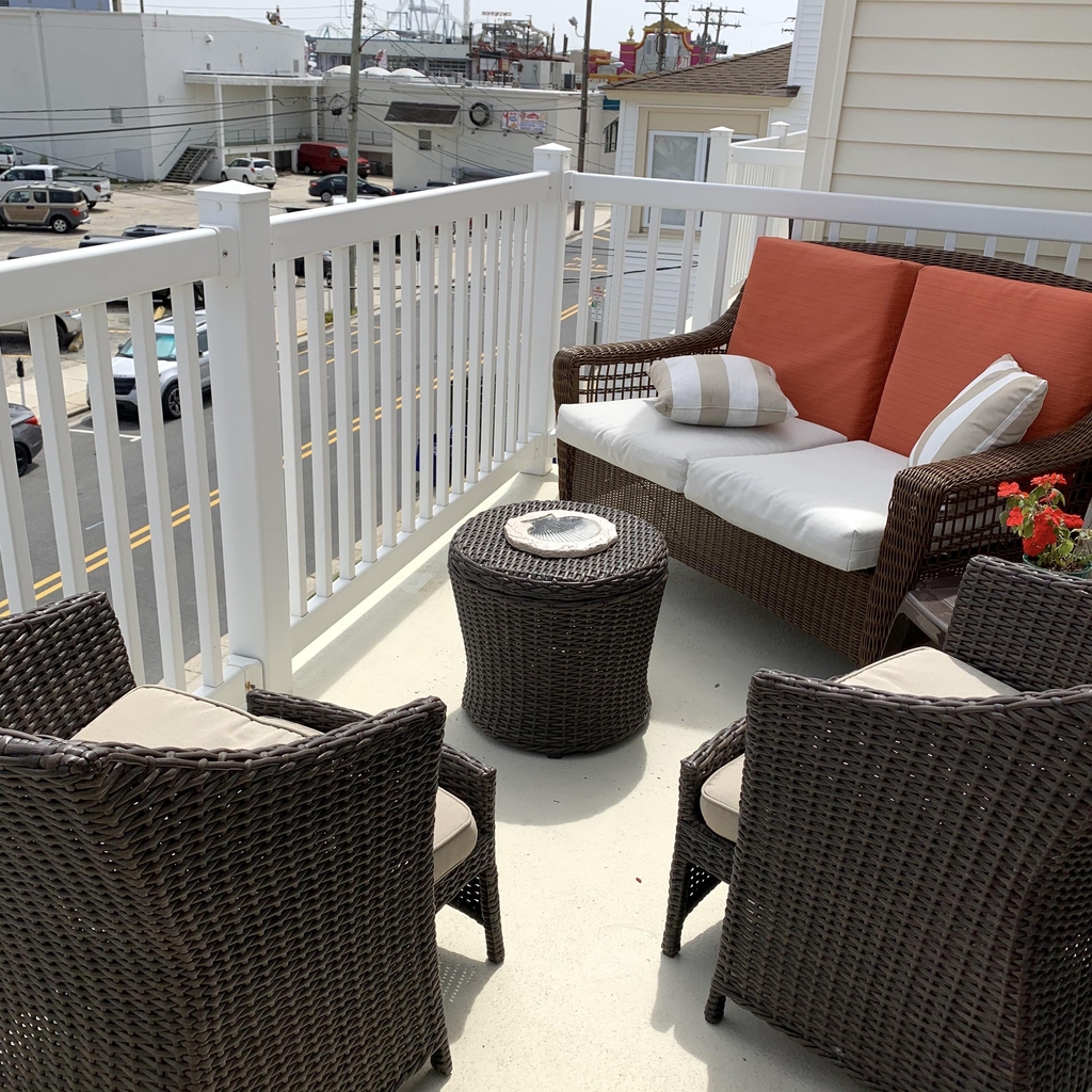 Furnished private deck with grille overlooking all the comings and goings of the Wildwoods l, steps to beach, boardwalk and piers 