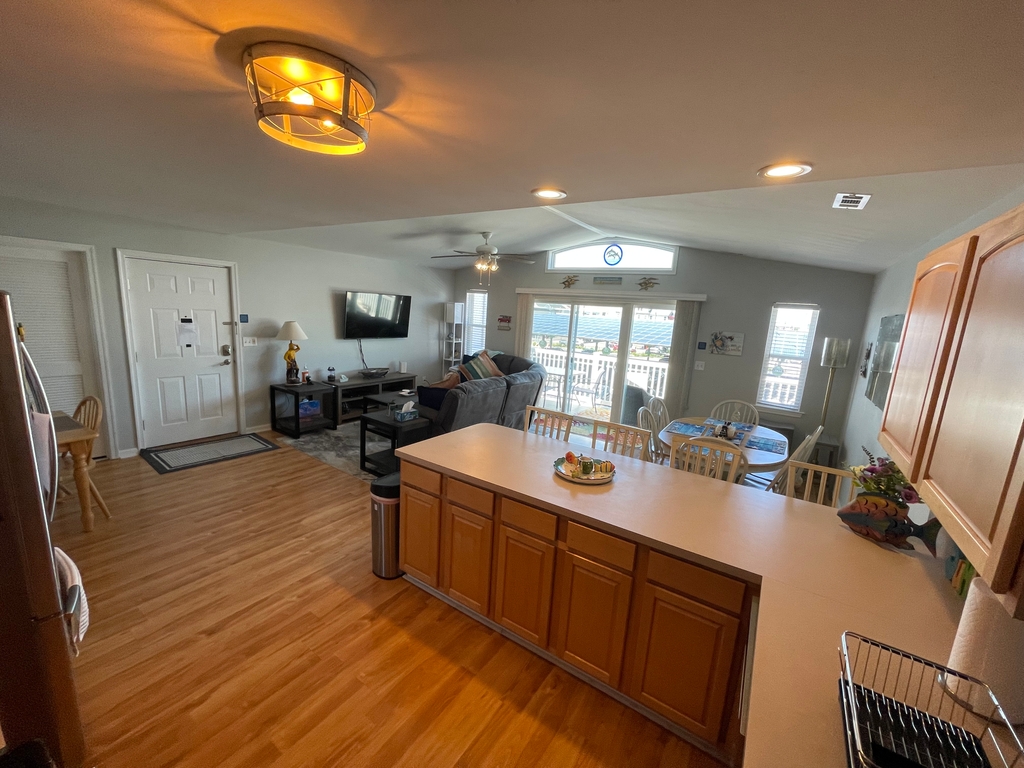 Kitchen looking towards great room, plenty of storage with additional seating for four