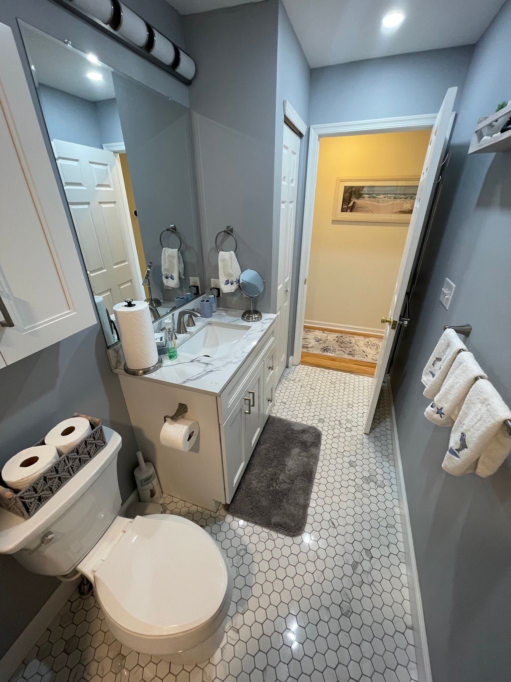 New hall bath with linen closet, walk in tub, and shower 