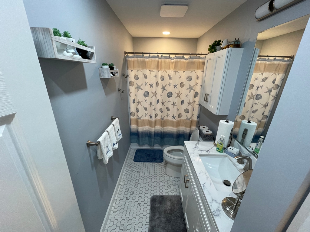 New Hall with tub, shower, extra lighting l, large vanity l, linen closet 