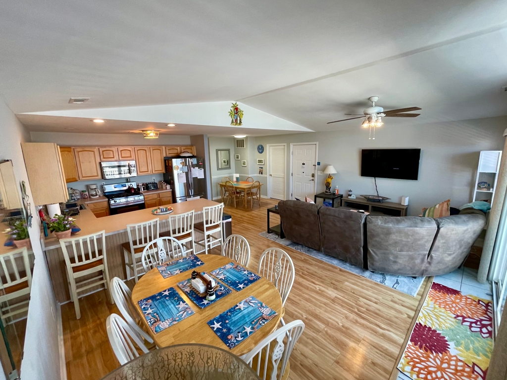 Large dining area, kitchen and seating view from the slider 