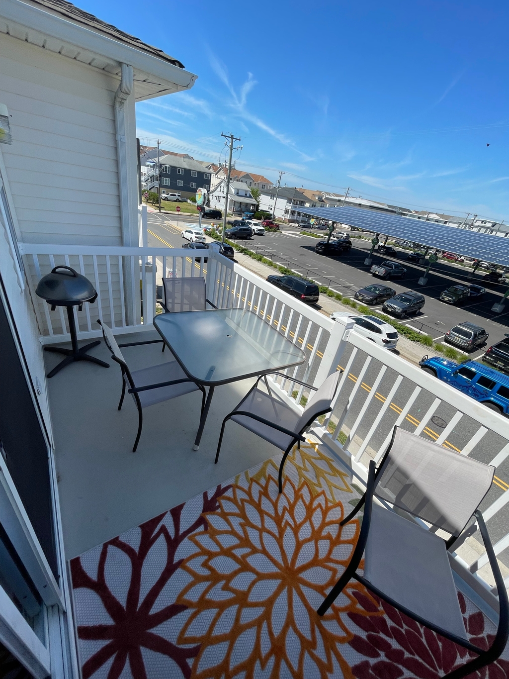 Large furnished deck with grille overlooking all the comings and goings of the Wildwoods 