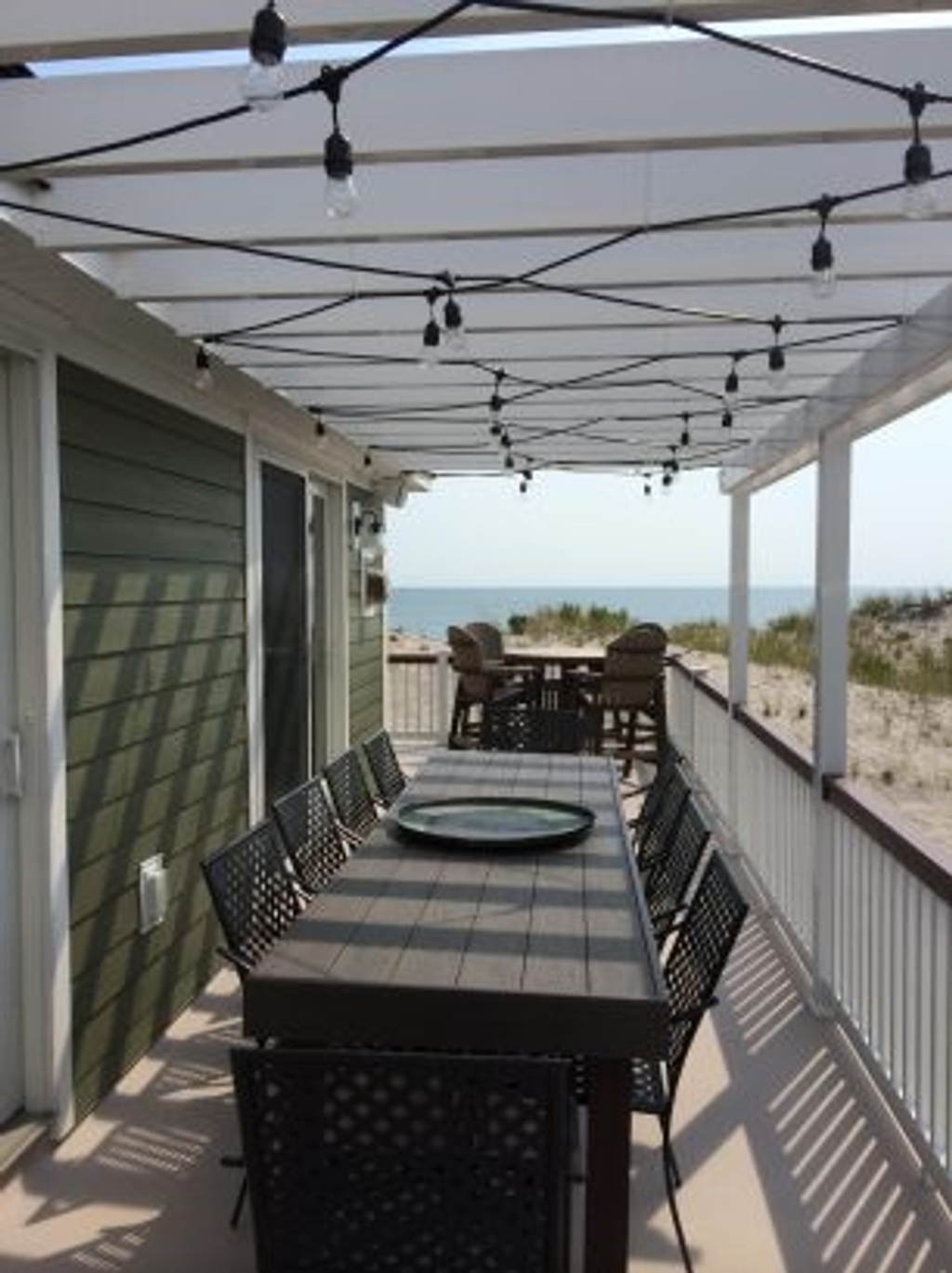Outside entertaining space...Southside deck dining table...seats 10
