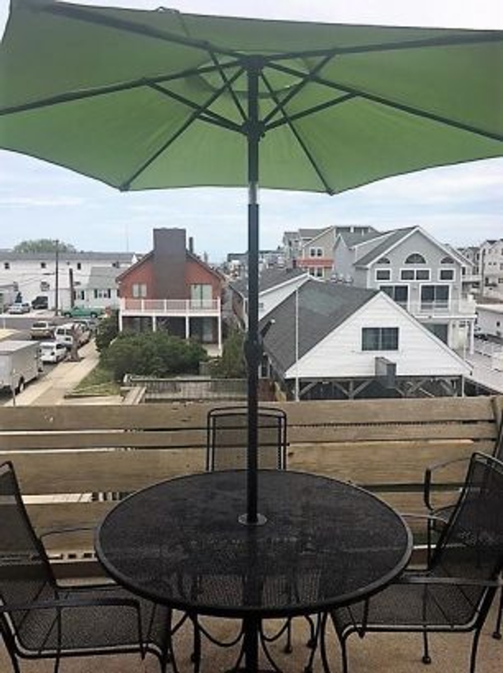 View of deck with table/chairs/grill