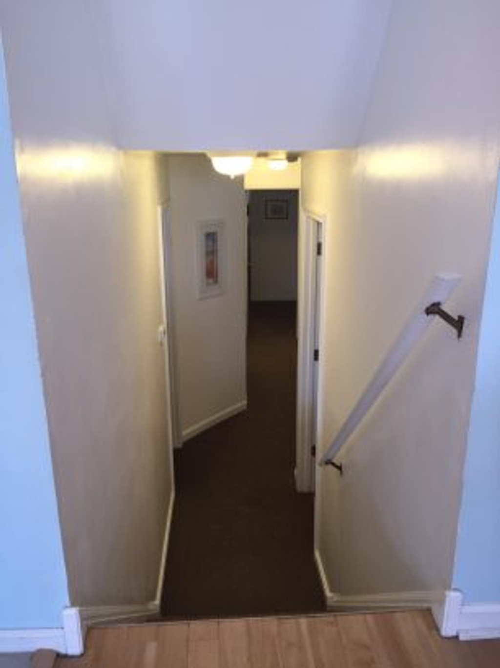 A few steps down from the main living area leads to a quiet level for the bedrooms and bathrooms