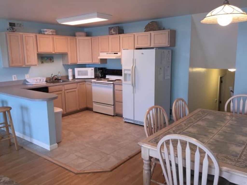 Fully stocked kitchen with drip coffeemaker, microwave, blender, etc.