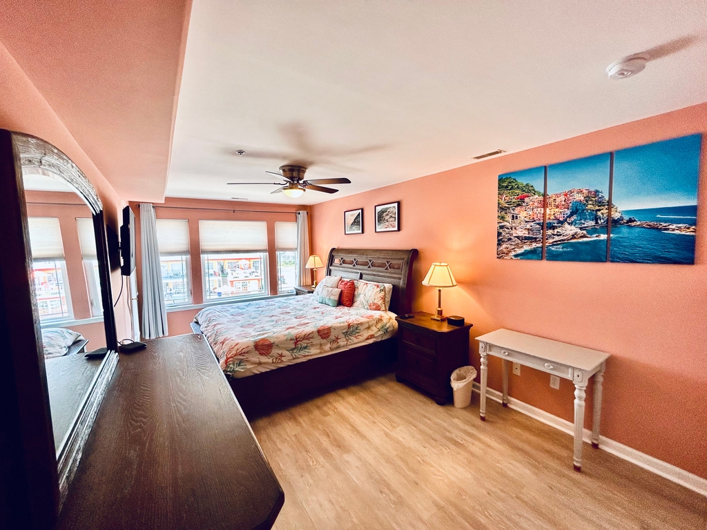 with mounted TV and private entrance to the balcony