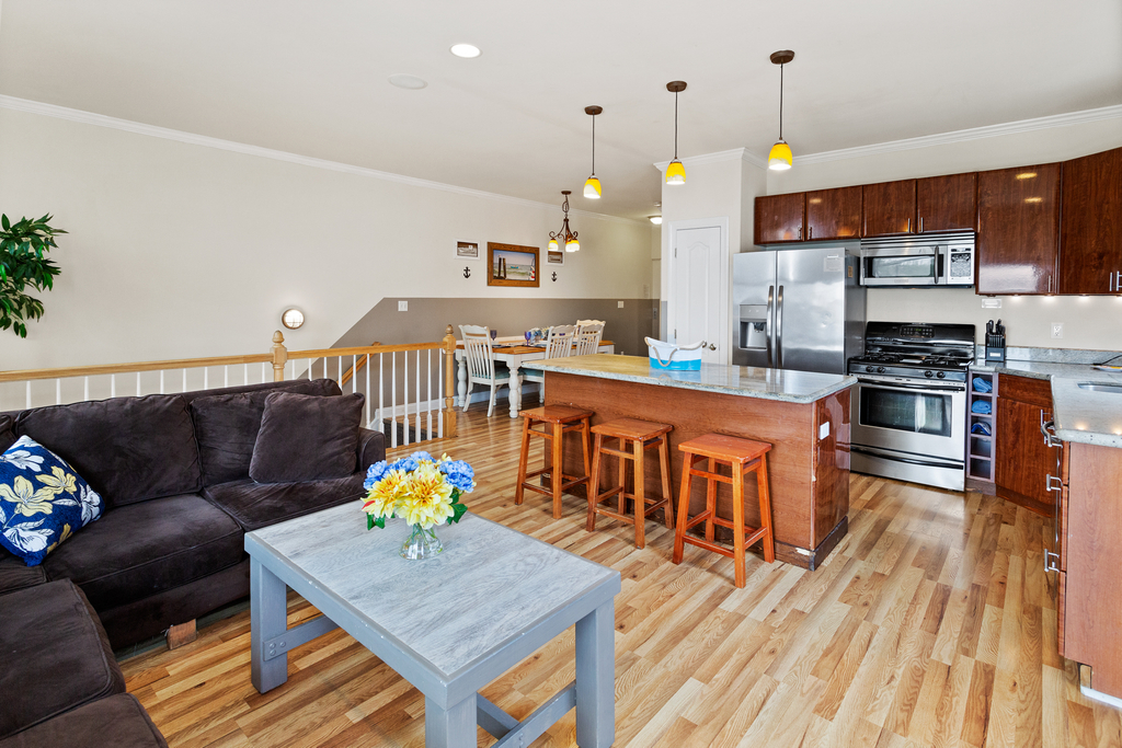 ❤️ Beautiful kitchen and living room area! A Great Place for you to gather with friends and family! Enjoy water views and the fresh sea air from the Large Outside Deck! A 65&amp;rdquo; 4K TV with Free HBO, Sports Channels, and lots of channels are available!