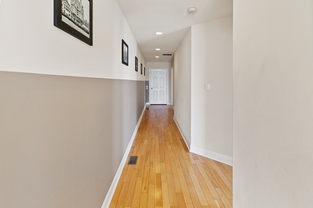 ❤️ The hallway starts at the Elevator and takes you to both Master Bedrooms and to a beautiful staircase on the other side with a unique chandelier and great water views! You will love it!