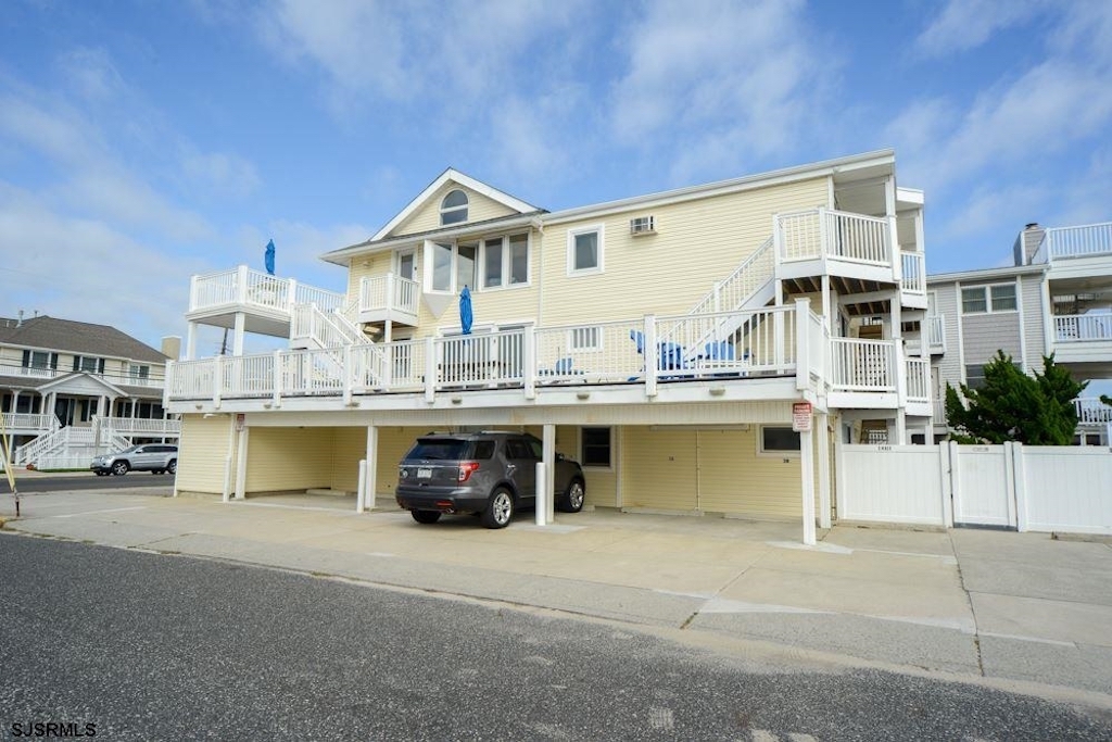 View of building from the street (3C with peaked roof and private deck)