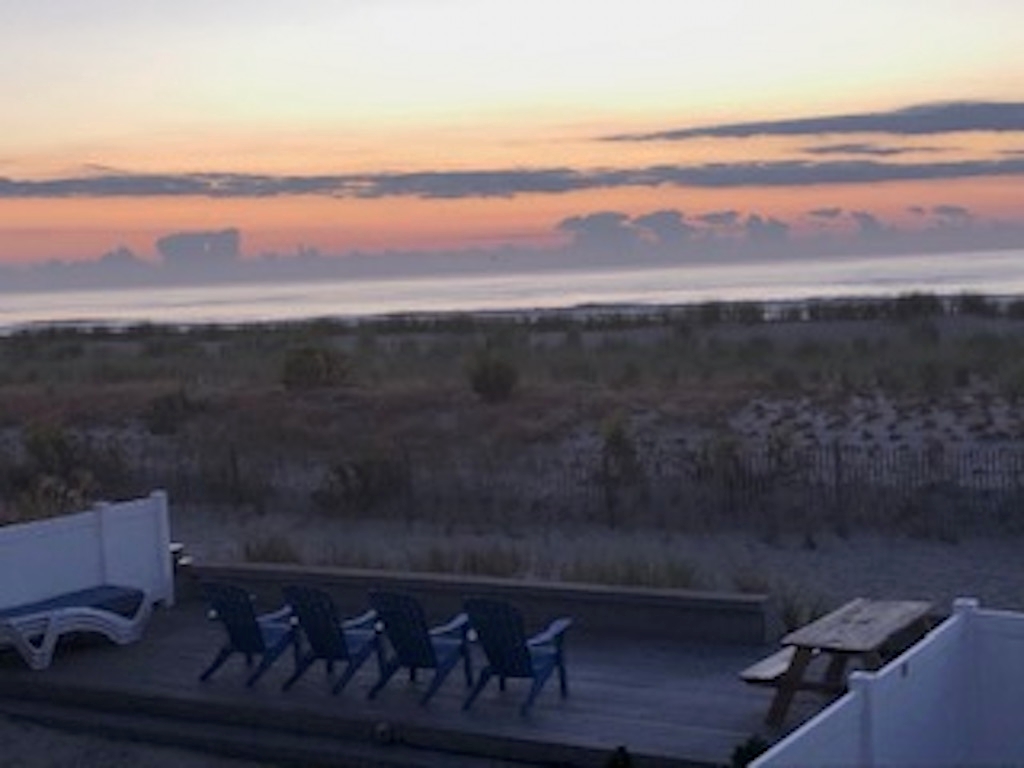 Sunrise from outside common area to include propane grills and outside shower