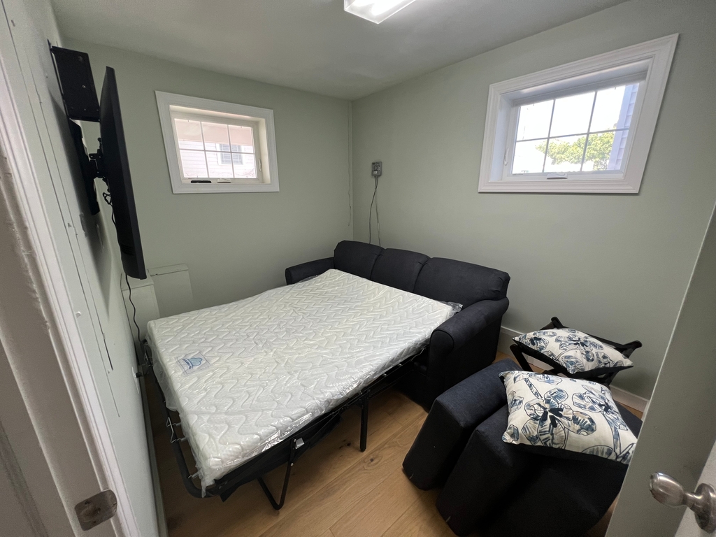 Ground level extra room with Queen sleeper sofa. Has central air, but note no bathroom on this level.