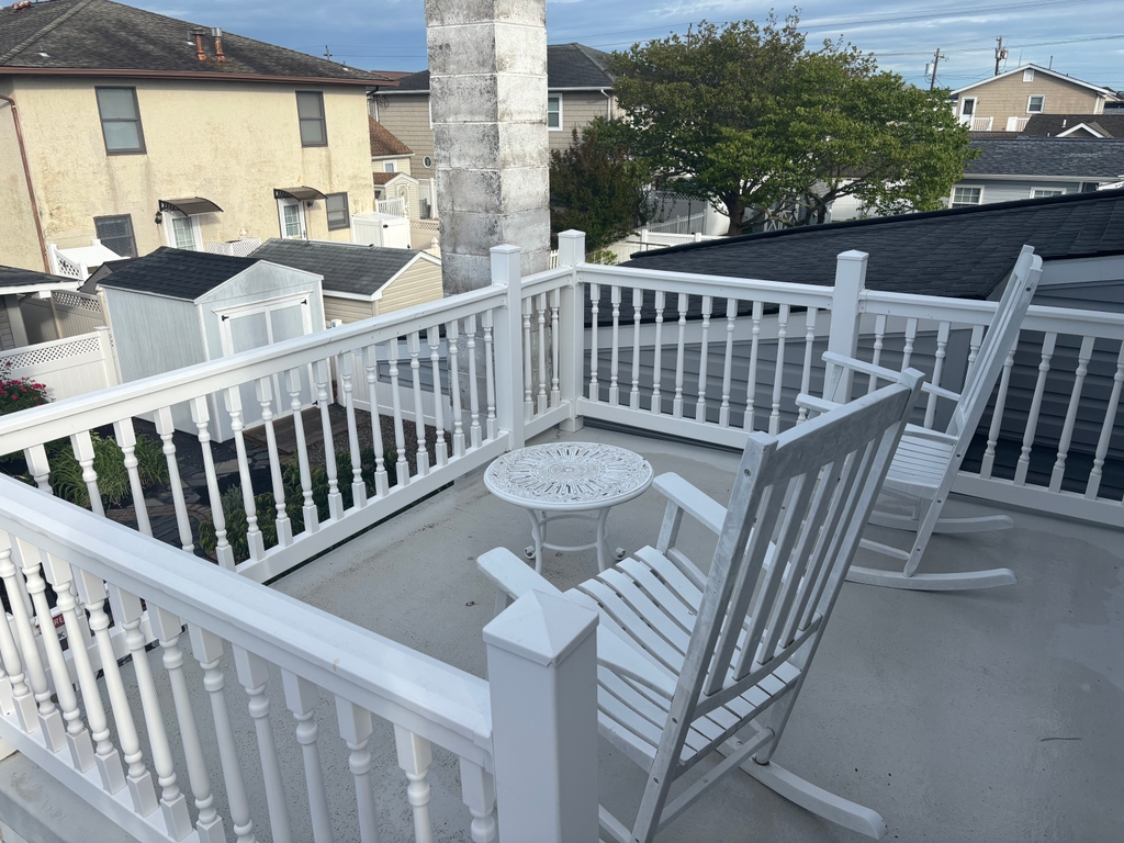 Upstairs deck with stairs to downstairs deck